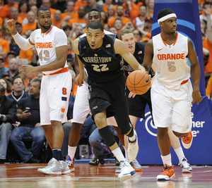 Otto Porter breaks away from Syracuse forwards James Southerland and C.J. Fair. Porter scored 33 points in Georgetown's 57-46 win over Syracuse on Saturday.