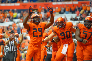 Running back Devante McFarlane (29) celebrates with teammates during SU's first ACC win of the year.
